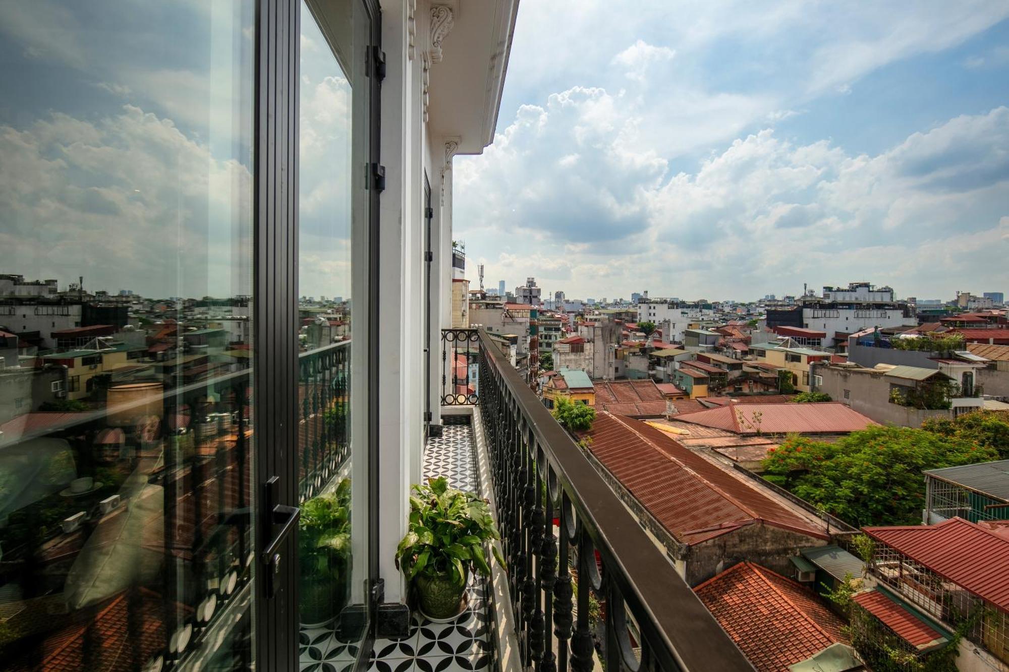 May De Ville Crown Hotel Hanoi Exteriör bild A view of the city from the balcony of a house in the district